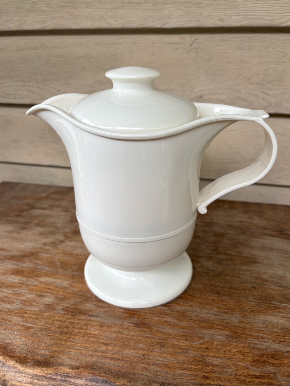 VTG JSNY insulated carafe features a white plastic exterior and a functional lid